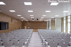 Auditorium with neutral-white lighting – Maria Ward schools